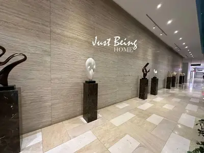 a lobby with a wall with some sculptures on it at Just Being Home 5pax 1BR/1BA 1Queen/1Single/1Sofa in Kuala Lumpur