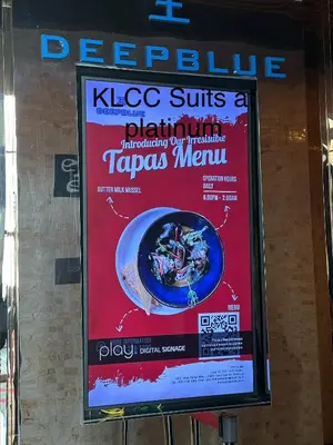 a sign in the window of a taco subs restaurant at KLCC Suites at Platinum in Kuala Lumpur