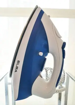 a blue and white helmet sitting on a shelf at Casa Residency Service Apartment By Moonlight in Kuala Lumpur