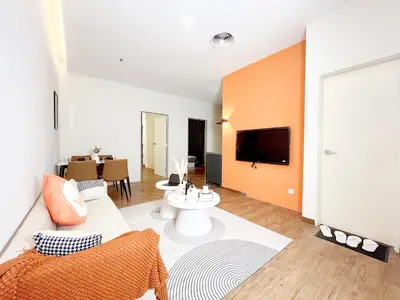a living room with a couch and a tv at The Latrobe - Bangsar Trade Centre in Kuala Lumpur