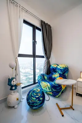 a living room with two chairs and a window at Skyscraper 65 KL Highest Outdoor Bathtub Luxury Lavish Designer Suite Penthouse Lv65 in Kuala Lumpur