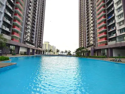 a large blue swimming pool between two tall buildings at KLCC VIEW Setapak Homestay 2BR KL view 8pax 15 min to KLCC PV21A R in Kuala Lumpur