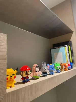 a shelf with a bunch of lego figurines on it at D’ Majestic Place by Bimbee in Kuala Lumpur