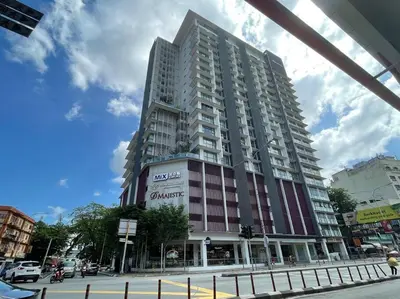 a tall building on the corner of a street at D’ Majestic Place by Bimbee in Kuala Lumpur