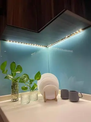a kitchen counter with a sink with plants and lights at D’ Majestic Place by Bimbee in Kuala Lumpur