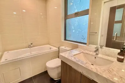 a bathroom with a tub and a toilet and a sink at D'Rapport Residence KL by manatidur in Kuala Lumpur
