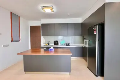 a kitchen with a counter top and a refrigerator at D'Rapport Residence KL by manatidur in Kuala Lumpur