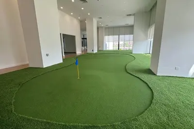 a large room with a golf ball on the grass at D'Rapport Residence KL by manatidur in Kuala Lumpur