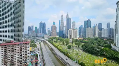 a view of a city with many tall buildings at Balcony KLCC View Kampung Baru Luxurious in Kuala Lumpur