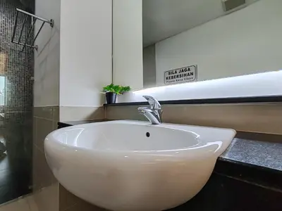 a white sink in a bathroom with a mirror at No Other Fee #Swiss Garden Residences by The Boston House #Bukit Bintang in Kuala Lumpur