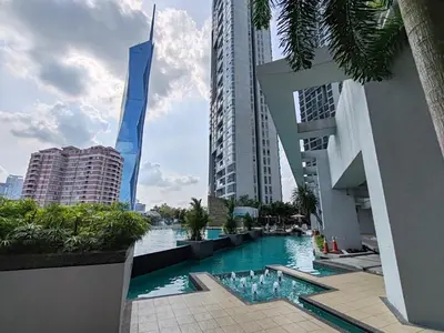 a swimming pool in the middle of a city with tall buildings at No Other Fee #Swiss Garden Residences by The Boston House #Bukit Bintang in Kuala Lumpur