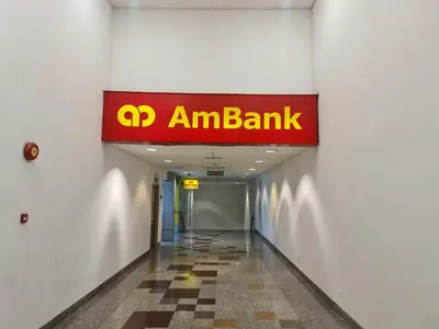 a sign for an am bank in a hallway at Raymond Suites at Times Square kuala Lumpur in Kuala Lumpur
