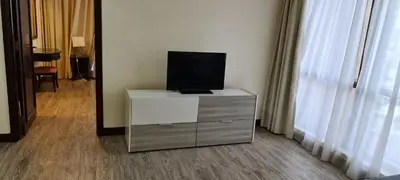 a television sitting on a dresser in a room at Raymond Suites at Times Square kuala Lumpur in Kuala Lumpur