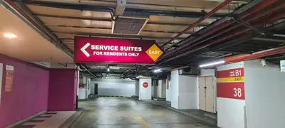 an empty hallway with a sign in a subway station at Raymond Suites at Times Square kuala Lumpur in Kuala Lumpur