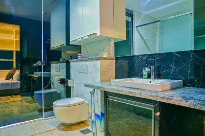 a bathroom with a sink and a toilet at SKYWARD SUITES at Platinum KLCC in Kuala Lumpur