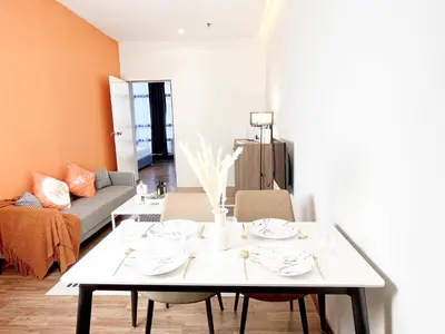 a living room with a table and a couch at The Lonsdale - Bangsar Trade Centre in Kuala Lumpur