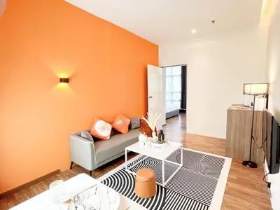 a living room with a couch and a table at The Lonsdale - Bangsar Trade Centre in Kuala Lumpur