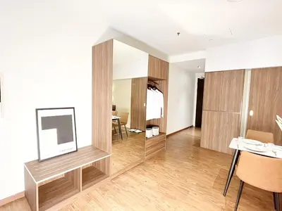 a living room with a mirror and a table at The Bourke - Bangsar Trade Centre in Kuala Lumpur