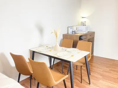 a dining room with a table and chairs at The Collins - Bangsar Trade Centre in Kuala Lumpur