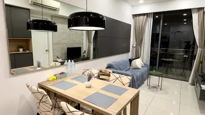 a living room with a table and a couch at Balcony Unit II & The Robertson Residence 33f in Kuala Lumpur