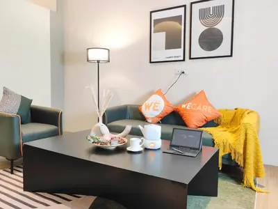 a living room with a coffee table and a couch at The Tranquil - Bangsar Trade Centre in Kuala Lumpur