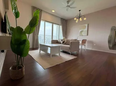 a living room with a couch and a table at UNA Residence By Feel Home Malaysia opposite Sunway Velocity Mall in Kuala Lumpur