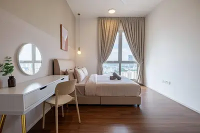 a bedroom with a bed and a desk and window at UNA Residence By Feel Home Malaysia opposite Sunway Velocity Mall in Kuala Lumpur