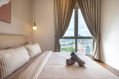 a bedroom with a large bed with a large window at UNA Residence By Feel Home Malaysia opposite Sunway Velocity Mall in Kuala Lumpur