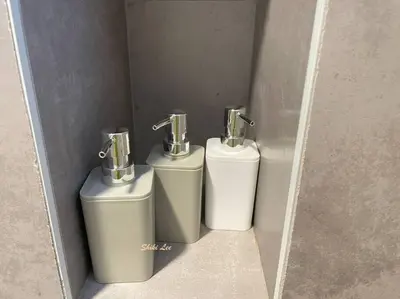 three toilets in a bathroom with a wall at Arte Mont Kiara_Publika_Solaris in Kuala Lumpur