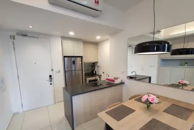 a kitchen with a table and a counter top at MyCrib19*The Robertson KL - Bukit Bintang Pavilion in Kuala Lumpur