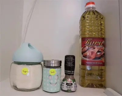 a refrigerator filled with food and a bottle of oil at MyCrib19*The Robertson KL - Bukit Bintang Pavilion in Kuala Lumpur