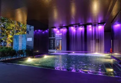 a house with a swimming pool with purple lights at Expressionz Kuala Lumpur in Kuala Lumpur