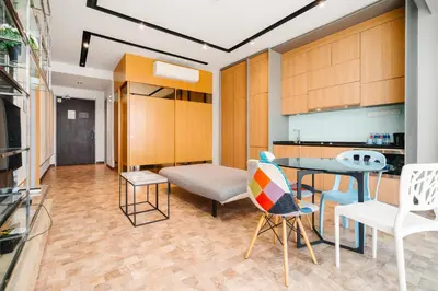 a living room with a table and chairs at Expressionz Kuala Lumpur in Kuala Lumpur