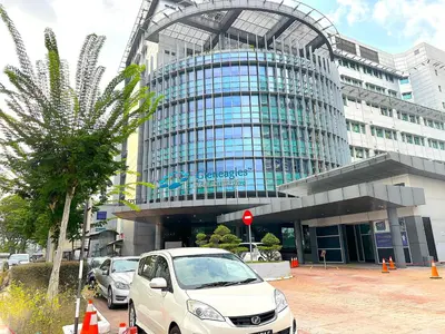 a white car parked in front of a building at Neu Suites By Serenity Homes Near Gleneagles, KLCC & LRT in Kuala Lumpur