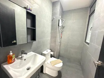 a bathroom with a white toilet and a sink at Neu Suites By Serenity Homes Near Gleneagles, KLCC & LRT in Kuala Lumpur