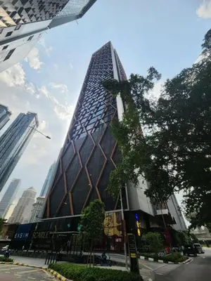 a tall building with a lot of windows at Scarletz Suites Klcc by Signature Apartment in Kuala Lumpur