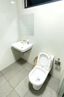 a bathroom with a toilet and a sink at The Home by Fidi @ Continew Residence (Near TREC) in Kuala Lumpur