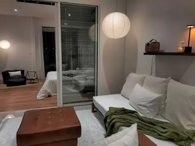 a living room with a couch and a table at Quill Residence by Cozy Simple Stay in Kuala Lumpur