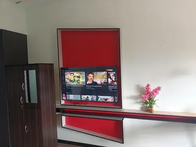 a flat screen tv sitting on top of a wall at James' Studio unit Maison 101 at Heritage Row, Kuala Lumpur in Kuala Lumpur