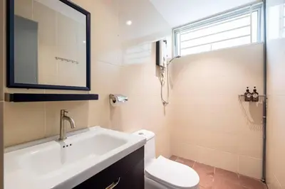 a bathroom with a sink and a toilet at RetroJazz Kids House 15pax 4Room in Kuala Lumpur