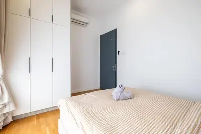 a bedroom with a bed with a pillow on it at Kids Wonderland opposite MyTown near TRX Mall MRT in Kuala Lumpur
