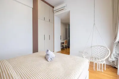 a bedroom with a bed with a stuffed animal on it at Kids Wonderland opposite MyTown near TRX Mall MRT in Kuala Lumpur
