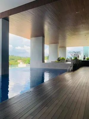a swimming pool with a view of the water at KL Sentral Bangsar Suites EST by Inam Suites in Kuala Lumpur