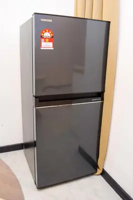 a refrigerator with its door open in a room at Neu Suites by Snugster 2 Bedroom, 3km to KLCC in Kuala Lumpur
