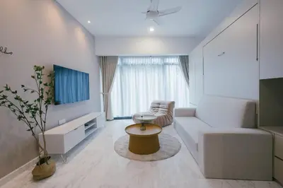 a living room with a couch and a table at NEW! Eaton Infinity SKY POOL KLCC view Pavilion in Kuala Lumpur