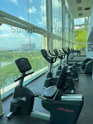 a row of exercise bikes in a gym with a large window at 3BR 5-6Pax Zetapark Setapak Central Near Zoo in Kuala Lumpur
