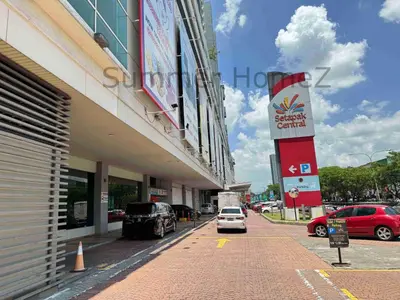 a car parked outside of a building with a car dealership at 3BR 5-6Pax Zetapark Setapak Central Near Zoo in Kuala Lumpur