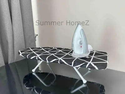a iron sitting on top of a glass table at 3BR 5-6Pax Zetapark Setapak Central Near Zoo in Kuala Lumpur