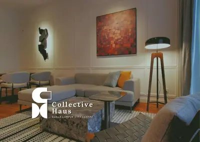 a living room with a couch and a table at The Mews KLCC Kuala Lumpur by Collective Haus in Kuala Lumpur