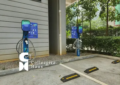 a couple of parking meters in front of a house at The Mews KLCC Kuala Lumpur by Collective Haus in Kuala Lumpur